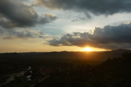Beautiful mountains and sunset at Khun Dan Dam Prakarnchon Damの写真素材