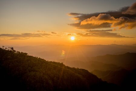 Sunset behind the mountain at Doi Thule, Tak, Thailandの写真素材