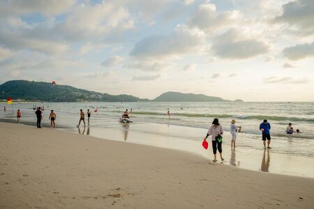 Phuket July 09, 2019 : The unidentified people are relaxing on Patong beach during a sunny day in Phuket, Thailand. Patong is one of famous beach located in the west coast of Phuket island.のeditorial素材