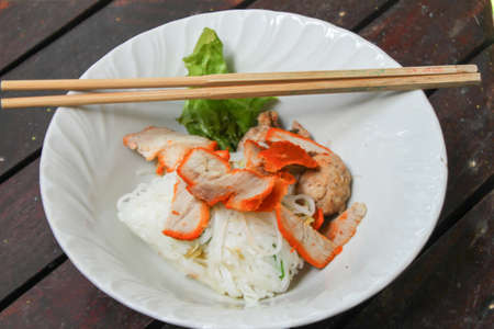 noodle and chopstick  in white bowlの写真素材