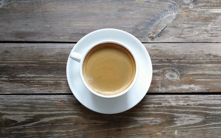 top view of cup of coffee with foamの写真素材