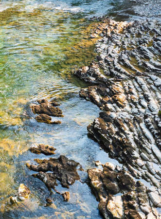 clean river flows over stones. High quality photo