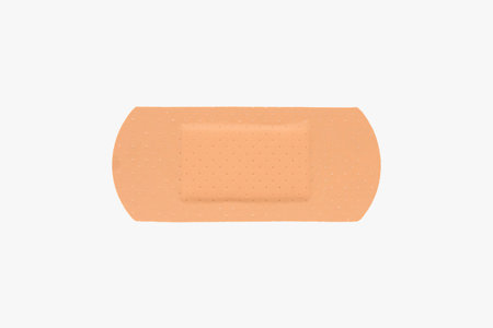close up of brown adhesive plaster isolated on whiteの写真素材