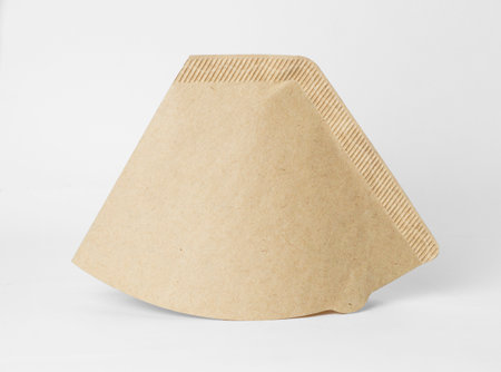 Cone type brown coffee filter isolated with shadow. High quality photoの写真素材