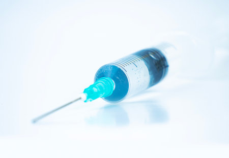 extreme close-up view of a syringe against a bright background. High quality photoの写真素材