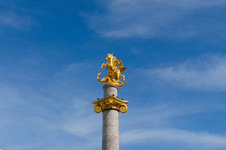 Golden statue of St. George stands proudly in Freedom Square, Tbilisiの写真素材