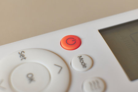 Control button on a white remote with a red power iconの写真素材