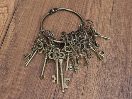 Old brass keys on a ring displaying intricate designs