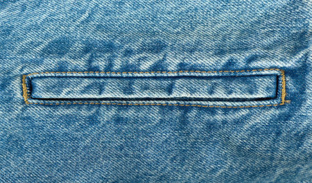 Close up view of denim fabric highlighting detailed seamsの写真素材
