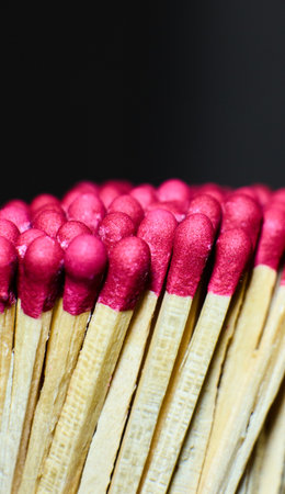 Matches grouped together with striking tips visibleの写真素材