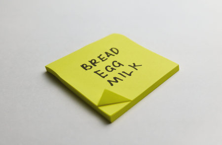 A yellow sticky note shows a grocery list with items