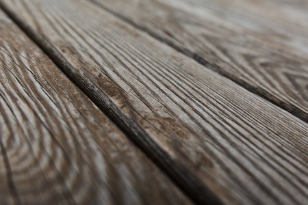 Detailed texture of rustic wooden planks in warm tonesの写真素材