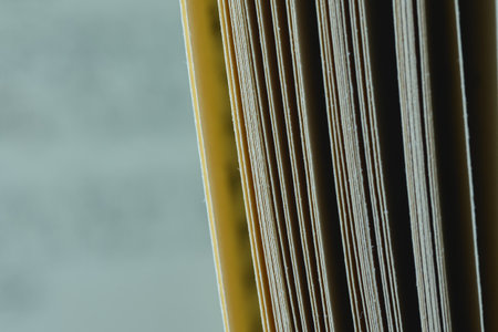 Close view of textured book pages revealing fine details. High quality photoの写真素材
