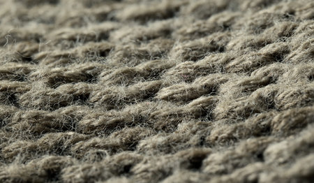 Close up view of textured woven fabric in natural tones. High quality photo