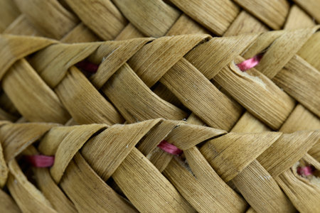 Close-up of a delicate handmade woven basket.の写真素材