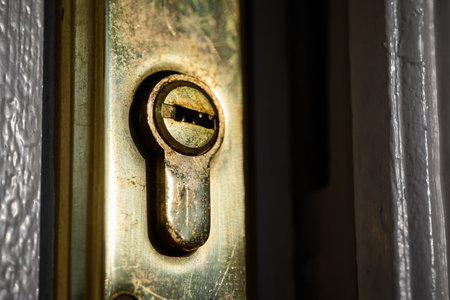 Vintage brass door lock with keyhole close-up.の写真素材