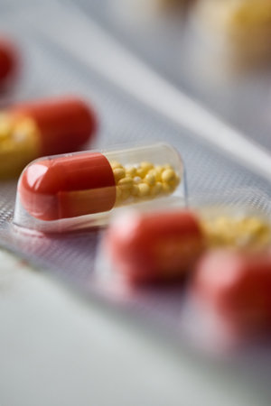 Capsules are arranged in a package on a table.の写真素材