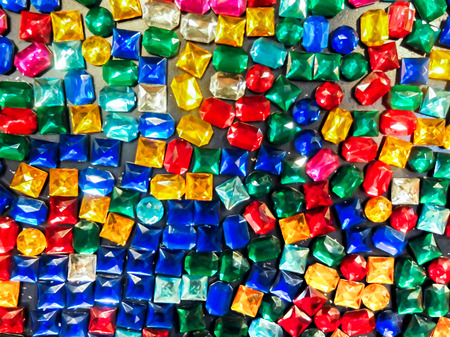 Colorful Jewelry Magnet on Black Wall used as Backgroundの写真素材
