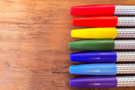 Colorful Marker Pens in Rainbow Order on Wooden Table used as Templateの写真素材