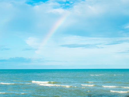 Blue Sea and Sky in Thailand with Rainbow after Rainingの写真素材