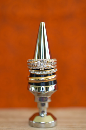 Wedding rings stacked on a bottle stopperの写真素材