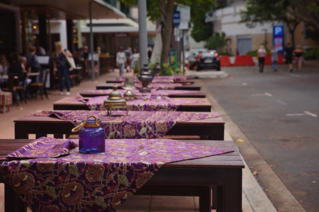 Road side Turkish restaurant tables set up ready for dinner on the side walkの写真素材