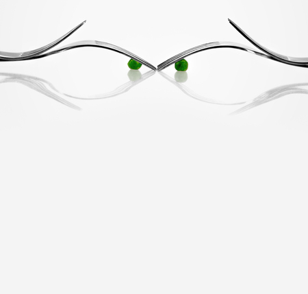 Fork and peas face card with copy space for business advertisement, corporate or personal greetingの写真素材