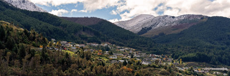 Houses on a mountain side in Queenstown New Zealand in autumn