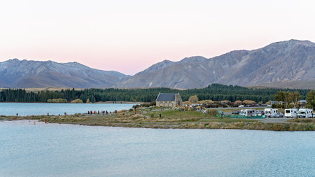 LAKE TEKAPO, NEW ZEALAND - April 2018: The beauty of the stone Church Of The Good Shepherd standing on the glacial shores of Lake Tekapo attracts visitors from all over the globe. 16th April 2018のeditorial素材