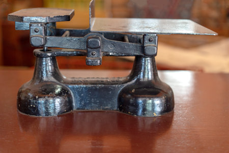 Vintage metal sales sitting on a polished wood counterの写真素材