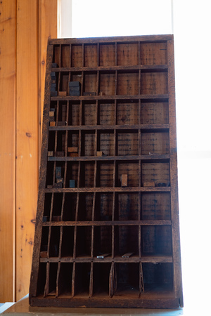 Compartments used by an old time printer to store printing equipment for businessの写真素材