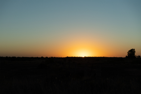 Road Trip - Beautiful early morning, orange sunrise at dawn in the countryの写真素材