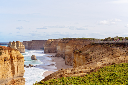 THE GREAT OCEAN ROAD, VICTORIA, AUSTRALIA - APRIL 18TH 2019: Spectators on the viewing platform at The Twelve Apostles, famous tourist destinationのeditorial素材