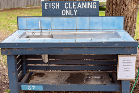 Wash tub for fish cleaning in a holiday park for anglersの写真素材