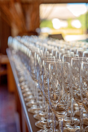 Rows of wine glasses ready for guests to drink cellar door wines at an Australian country vineyard...