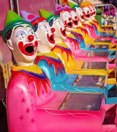 MACKAY, QUEENSLAND, AUSTRALIA - JUNE 2019: A game of chance pulling balls into rotating clown heads at Mackay Annual Showのeditorial素材