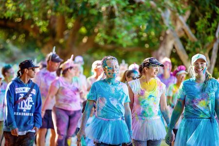 MACKAY, QUEENSLAND, AUSTRALIA - JUNE 2019: Unidentified women wearing a colorful costumes walking together in Color Frenzy Fun Runのeditorial素材