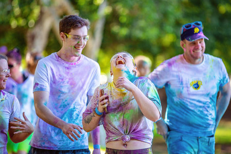 MACKAY, QUEENSLAND, AUSTRALIA - JUNE 2019: Unidentified young woman laughing out loud with friends...