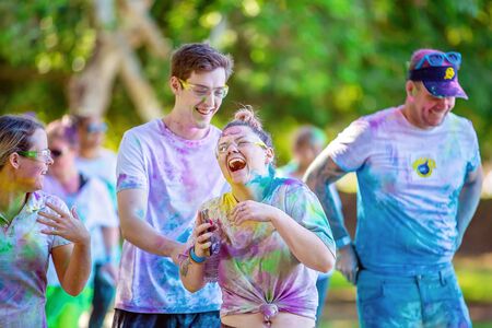MACKAY, QUEENSLAND, AUSTRALIA - JUNE 2019: Unidentified young woman laughing out loud with friends in Color Frenzy Fun Runのeditorial素材