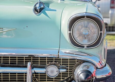 MACKAY, QUEENSLAND, AUSTRALIA - 13th July 2019: Close up of front headlight and grill of blue custom classic carのeditorial素材