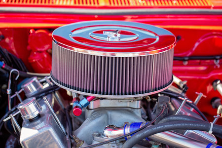 MACKAY, QUEENSLAND, AUSTRALIA - 13th July 2019: Close up of carburettor in engine of red custom classic carのeditorial素材