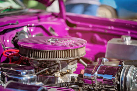 MACKAY, QUEENSLAND, AUSTRALIA - 13th July 2019: Close up of carburettor and engine of pink custom...