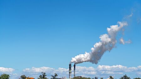 Clouds of smoke emitted into the environment from crushing season at an Australian sugar cane mill refineryの写真素材