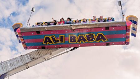 SARINA, QUEENSLAND, AUSTRALIA - AUGUST 2019: People enjoying a high and fast thrill ride at Sarina local country showのeditorial素材