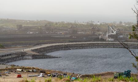 Mackay, Queensland, Australia - September 8th 2019: Dalrymple Bay Export Coal Loading Terminal water reservoir on a hazy dayのeditorial素材