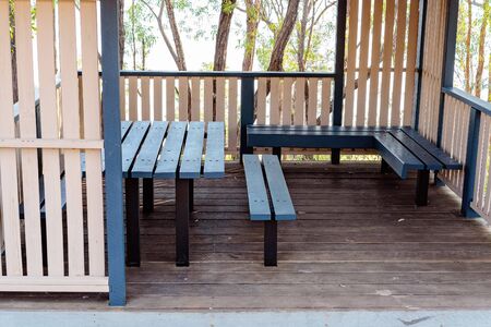Interior of an outdoor shade hut with table and seating for family picnicsの写真素材