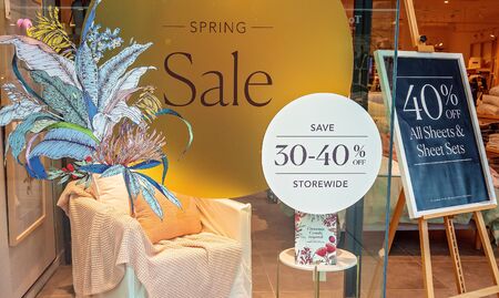 Brisbane, Queensland, Australia - 25th September 2019: Spring sale discounts advertised in store window displayのeditorial素材