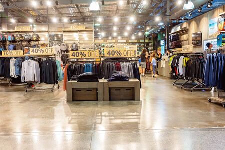Brisbane, Queensland, Australia - 26th September 2019: Inside a male clothing store with discounted fashions for saleのeditorial素材