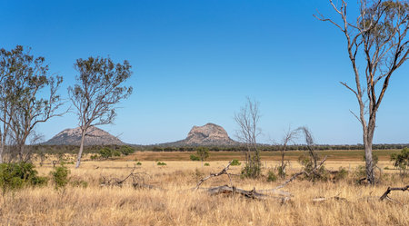 An outback Australia mountain range against a clear blue sky