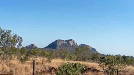 An outback Australia mountain range against a clear blue skyの写真素材